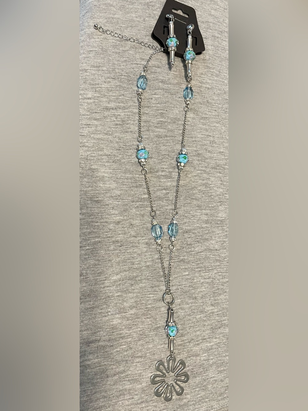 Silver-Tone Necklace with Blue Beads and Floral Pendant